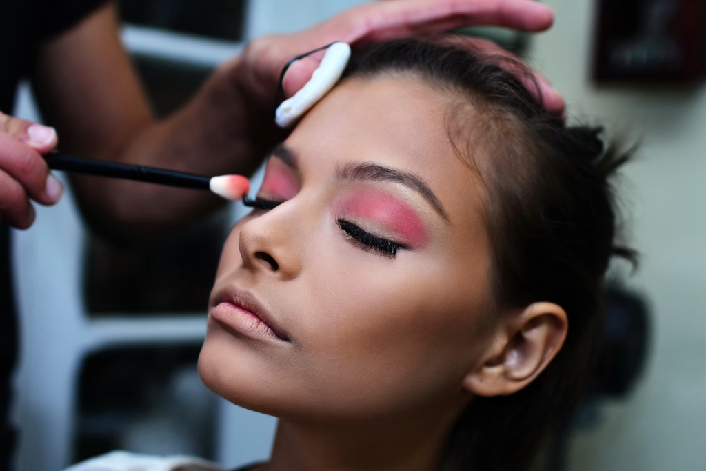 a girl wearing pink eyeshadow
